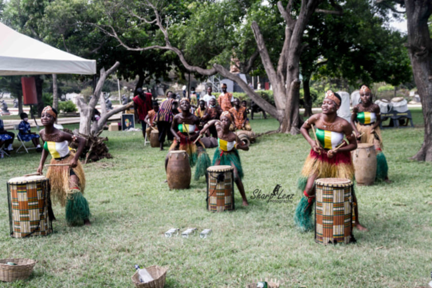 ASODA students playing African drums in traditional attire